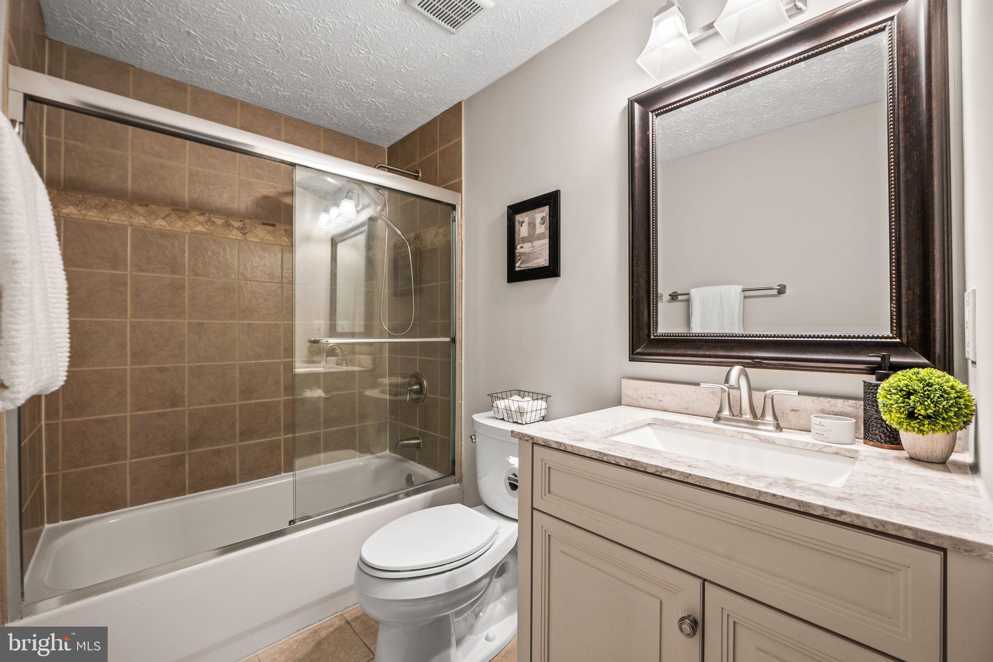 1747 Sundance Drive Reston, VA 20194 - Photo 18 of 36 a bathroom with a sink a toilet and shower