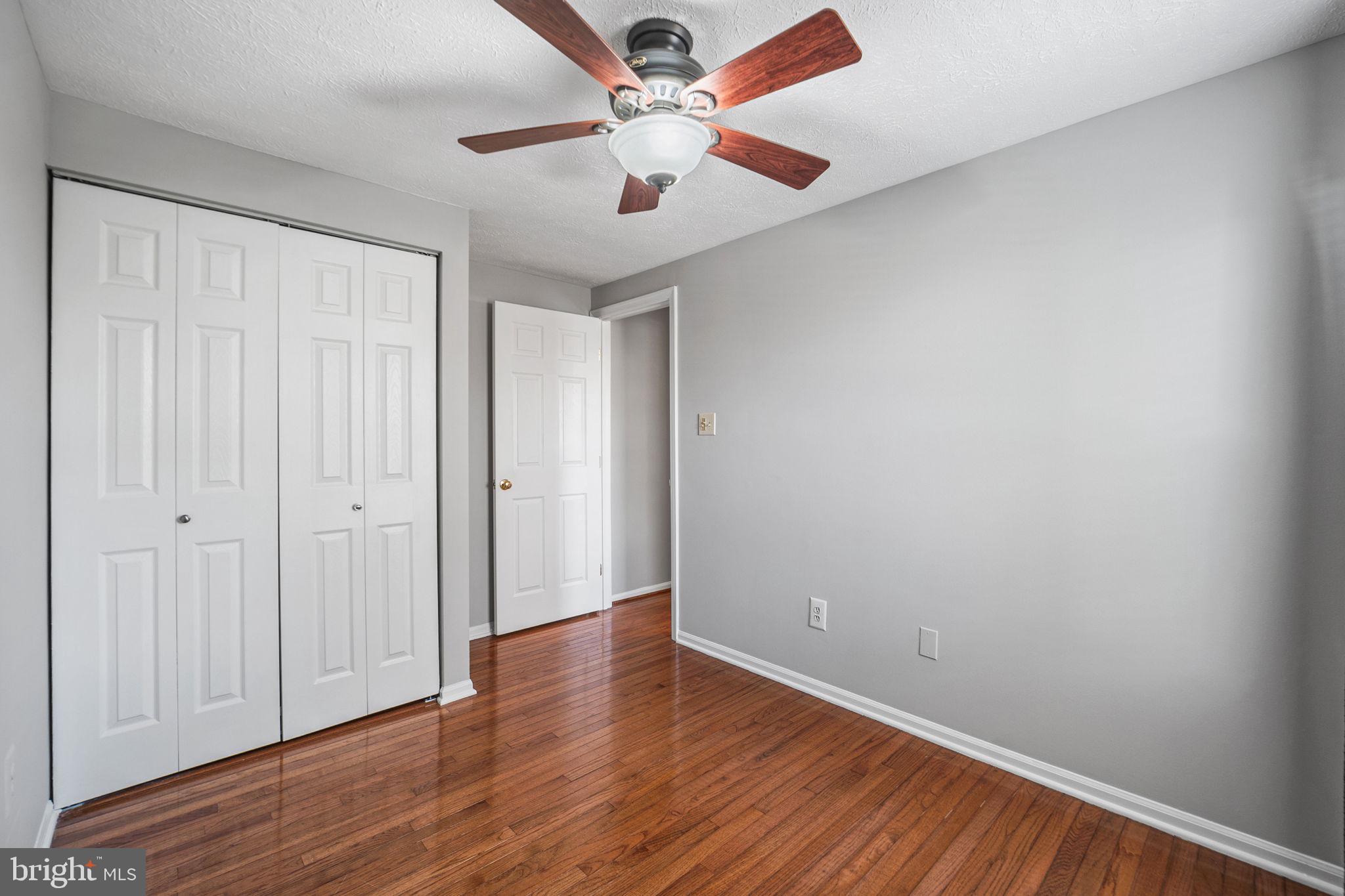 1747 Sundance Drive Reston, VA 20194 - Photo 22 of 36 a view of an empty room with wooden floor