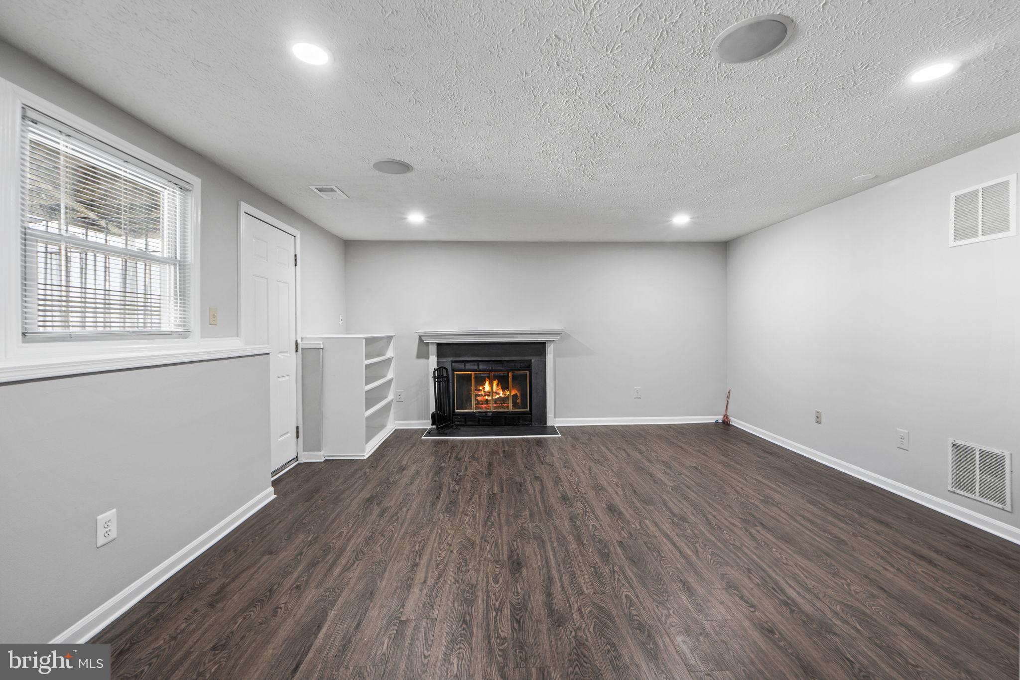 1747 Sundance Drive Reston, VA 20194 - Photo 24 of 36 a view of an empty room with wooden floor and a window