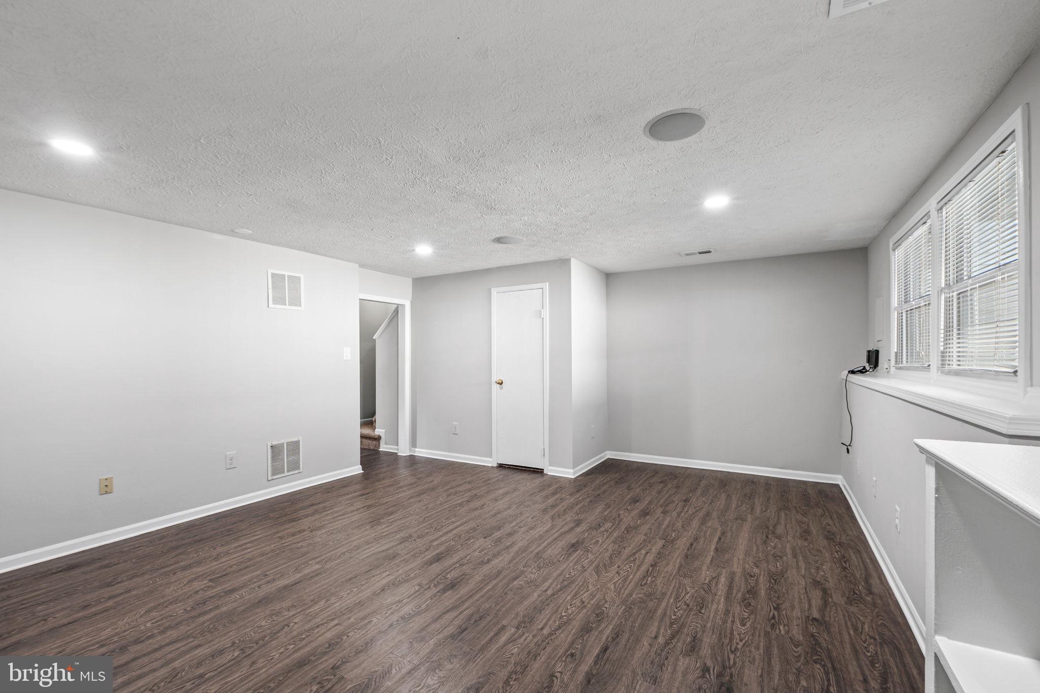 1747 Sundance Drive Reston, VA 20194 - Photo 26 of 36 a view of an empty room with wooden floor and a window