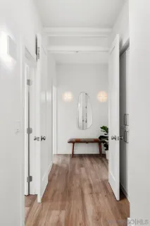 a view of a room with glass door and furniture