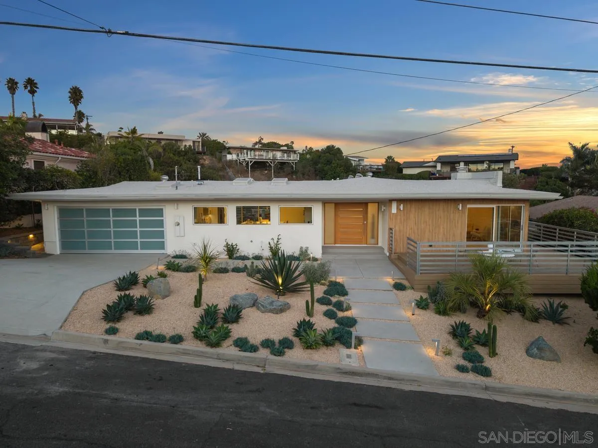5851 Box Canyon Road La Jolla, CA 92037 - Photo 2 of 39 a front view of a house with garden