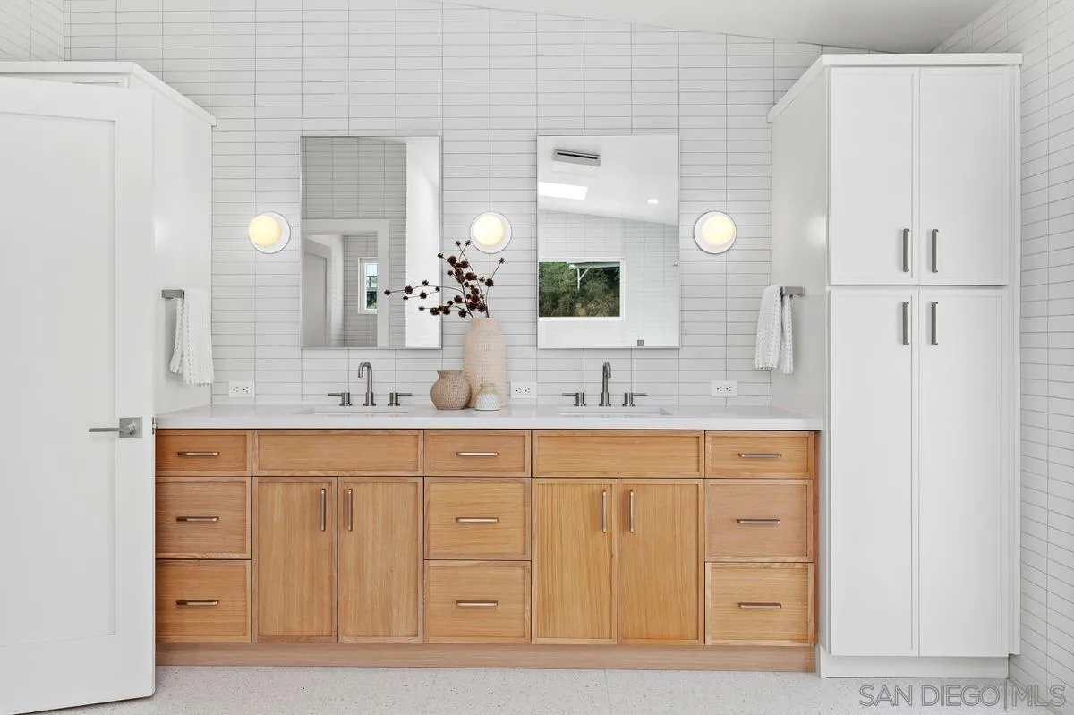 5851 Box Canyon Road La Jolla, CA 92037 - Photo 22 of 39 a bathroom with a sink and a mirror