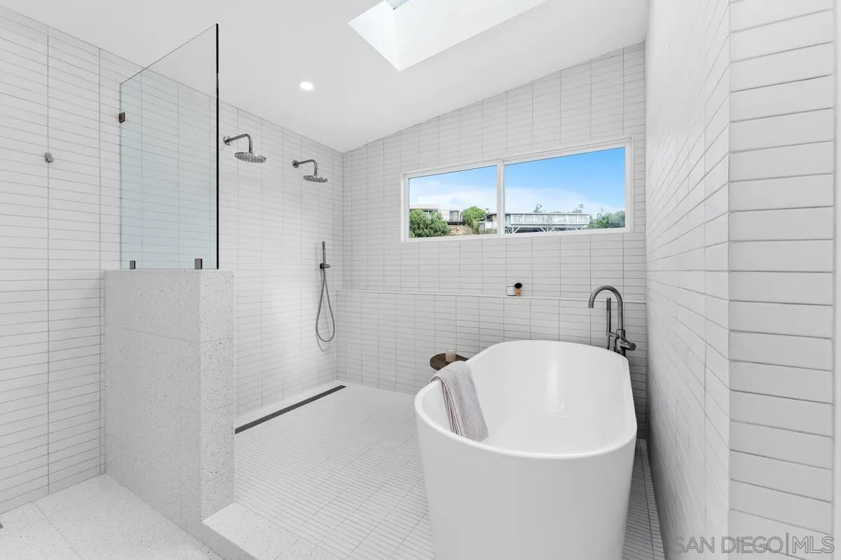 5851 Box Canyon Road La Jolla, CA 92037 - Photo 23 of 39 a bathroom with a bathtub and a sink