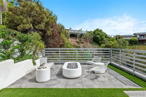 a view of a chairs and table on the patio