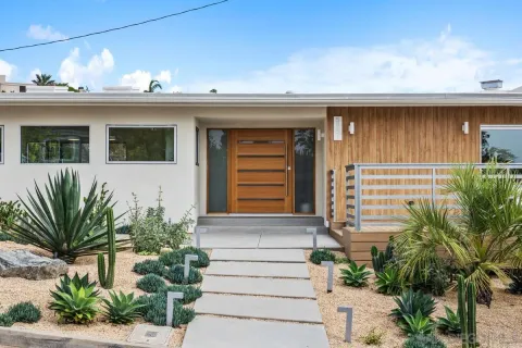 a front view of a house with a garage