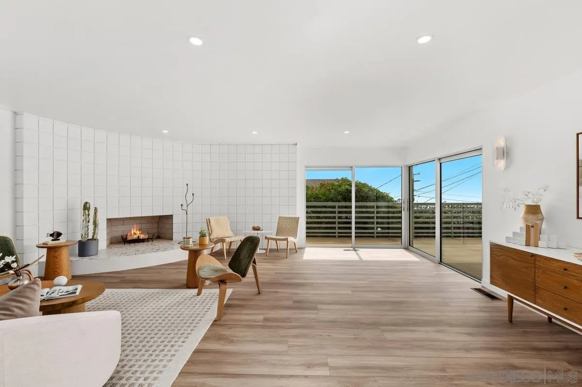 5851 Box Canyon Road La Jolla, CA 92037 - Photo 9 of 39 a living room with furniture a wooden floor and next to a window
