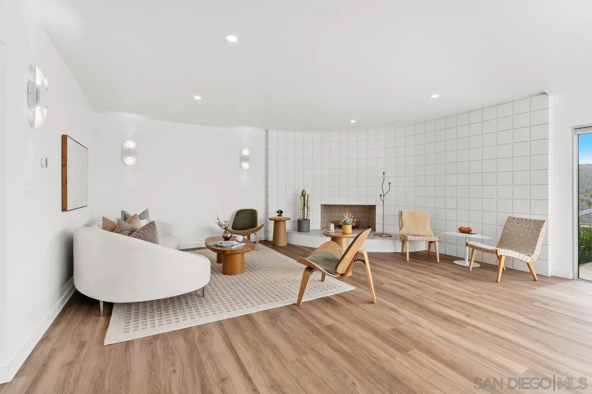 5851 Box Canyon Road La Jolla, CA 92037 - Photo 10 of 39 a living room with furniture and a wooden floor