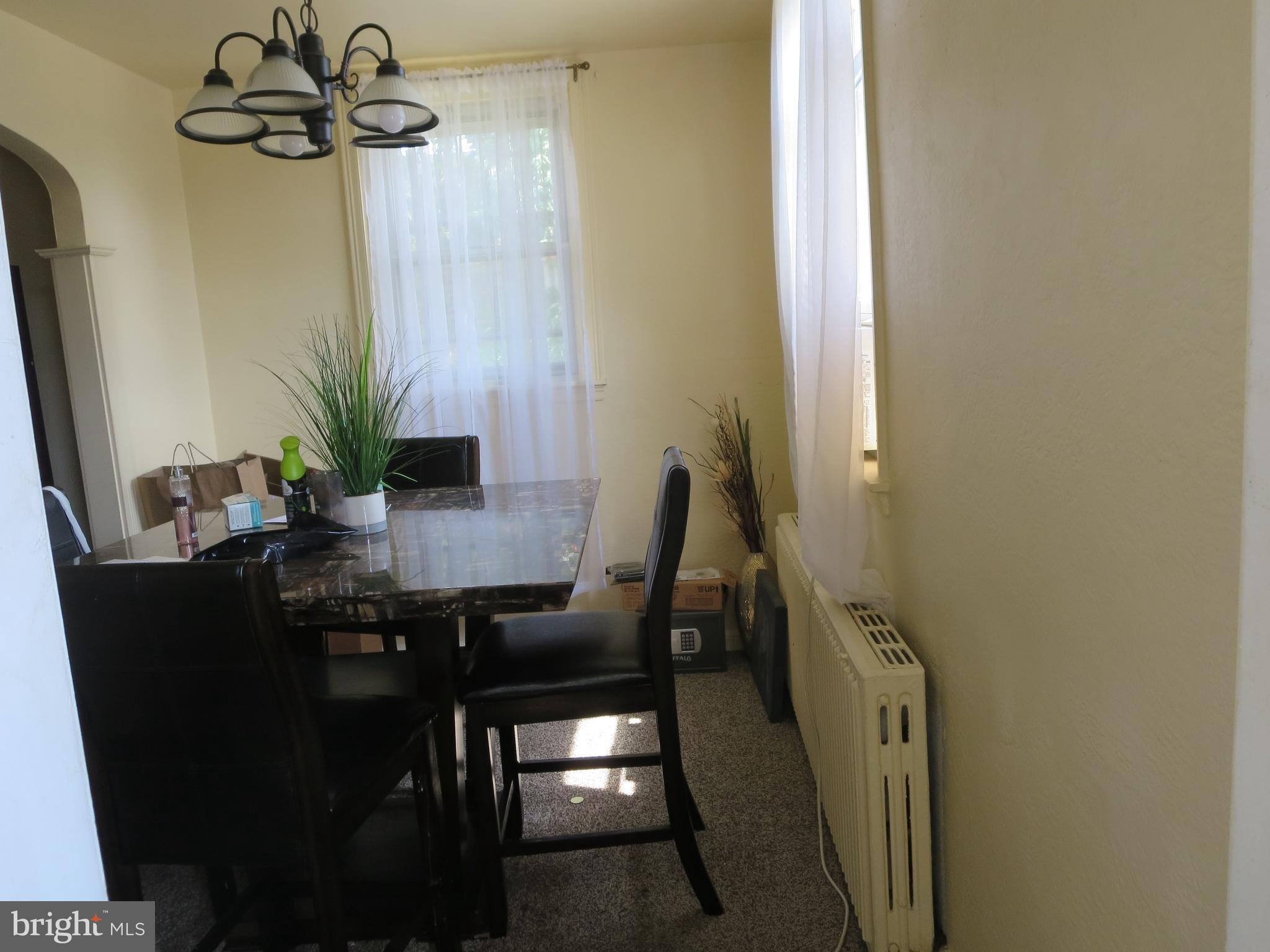 1025 Fanshawe Street Philadelphia, PA 19111 - Photo 9 of 13 a view of a dining room with furniture and a potted plant
