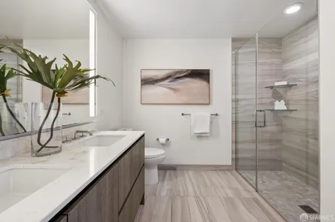 a bathroom with a shower and a sink