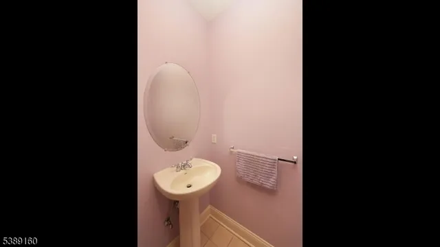 a bathroom with a sink and mirror