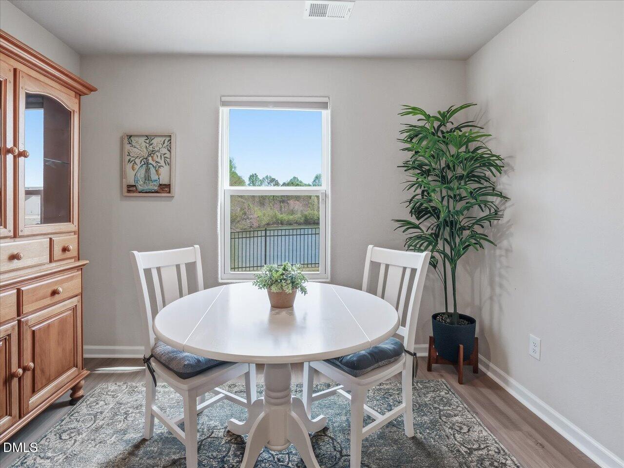 90 Barnsley Road Angier, NC 27501 - Photo 17 of 40 a view of a dining room with furniture and window