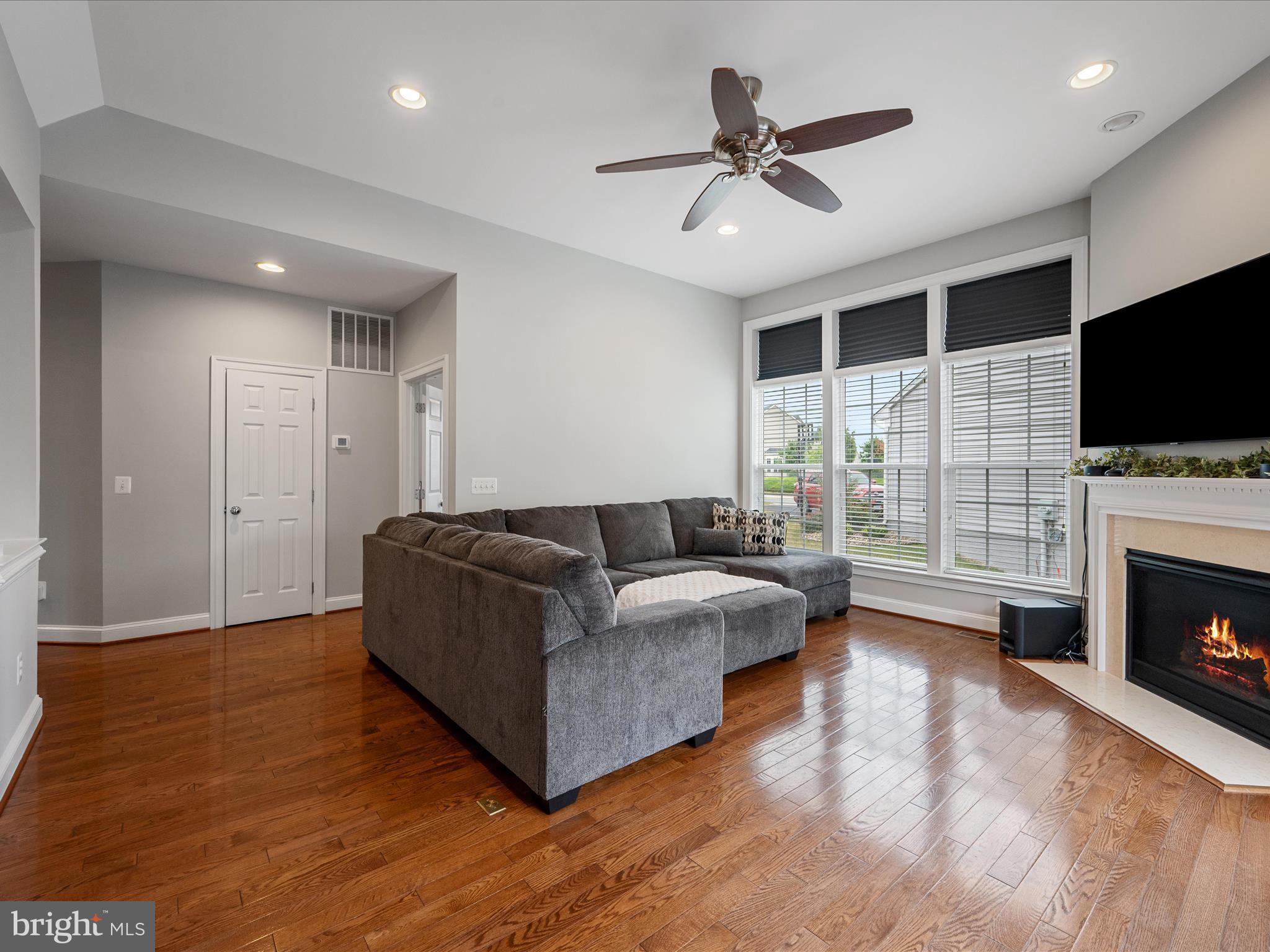 103 Prairie Place Stephenson, VA 22656 - Photo 16 of 90 a living room with furniture and a flat screen tv