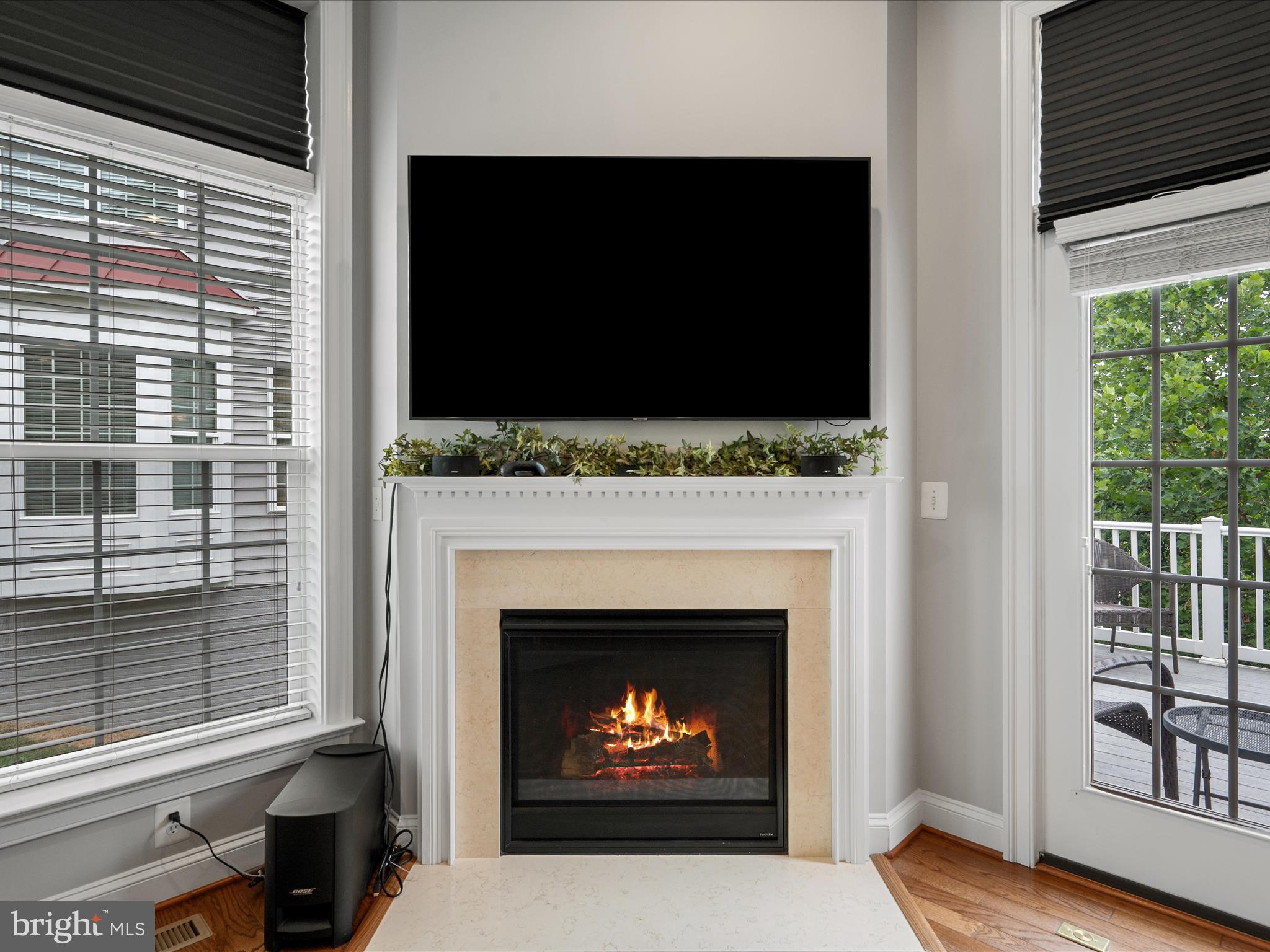 103 Prairie Place Stephenson, VA 22656 - Photo 17 of 90 a living room with a fireplace and a flat screen tv