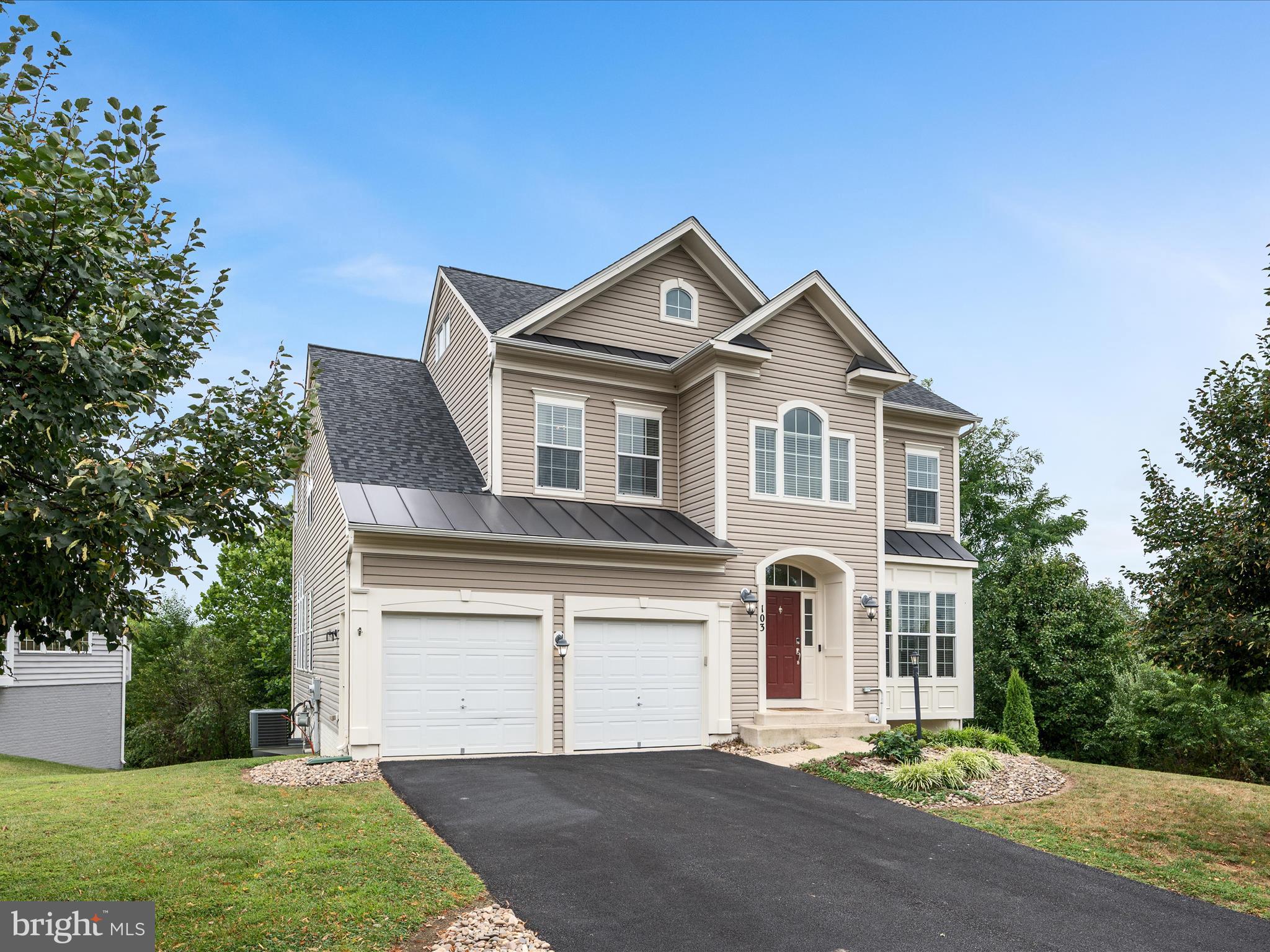 103 Prairie Place Stephenson, VA 22656 - Photo 2 of 90 a front view of a house with a yard and garage