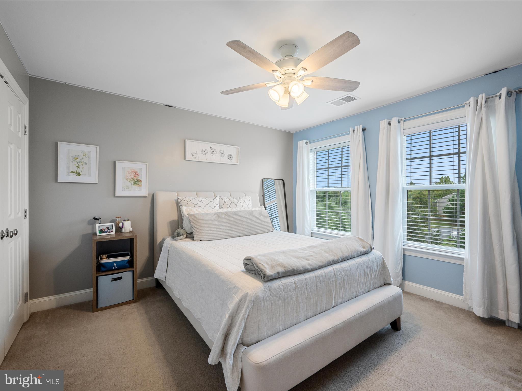 103 Prairie Place Stephenson, VA 22656 - Photo 34 of 90 a bedroom with a large bed and a chandelier