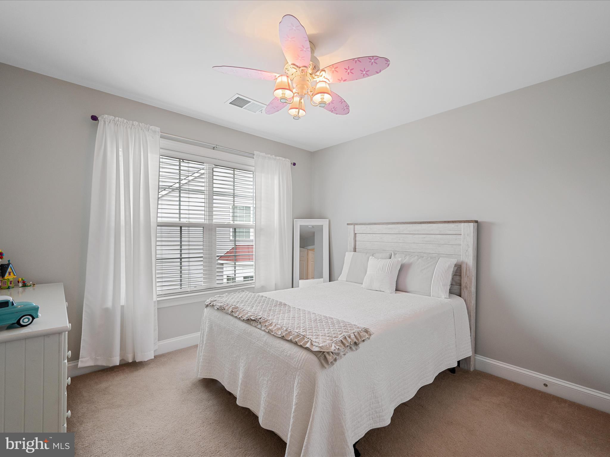 103 Prairie Place Stephenson, VA 22656 - Photo 38 of 90 a bedroom with a large bed and a chandelier fan