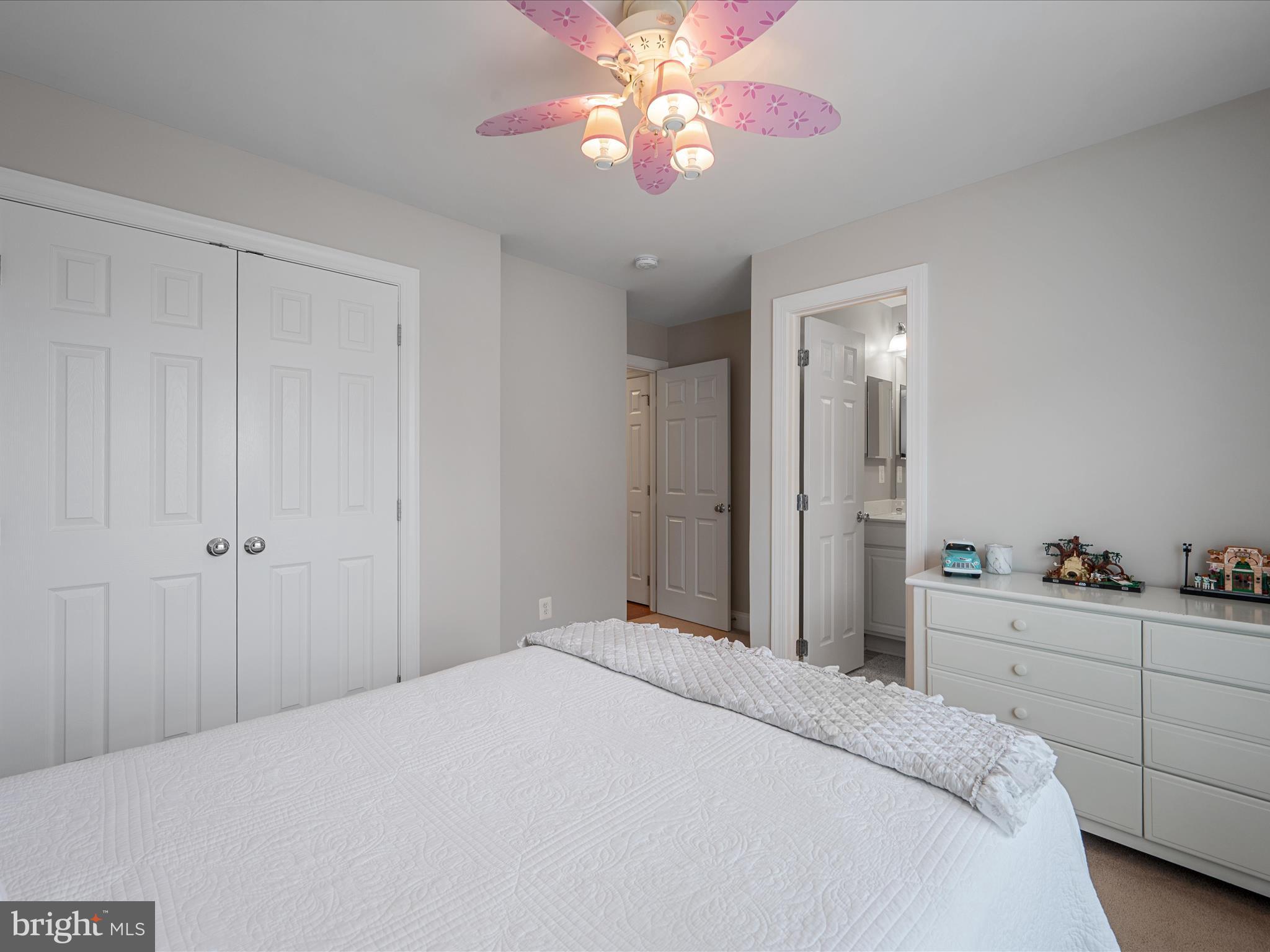 103 Prairie Place Stephenson, VA 22656 - Photo 39 of 90 a bedroom with a bed and a chandelier