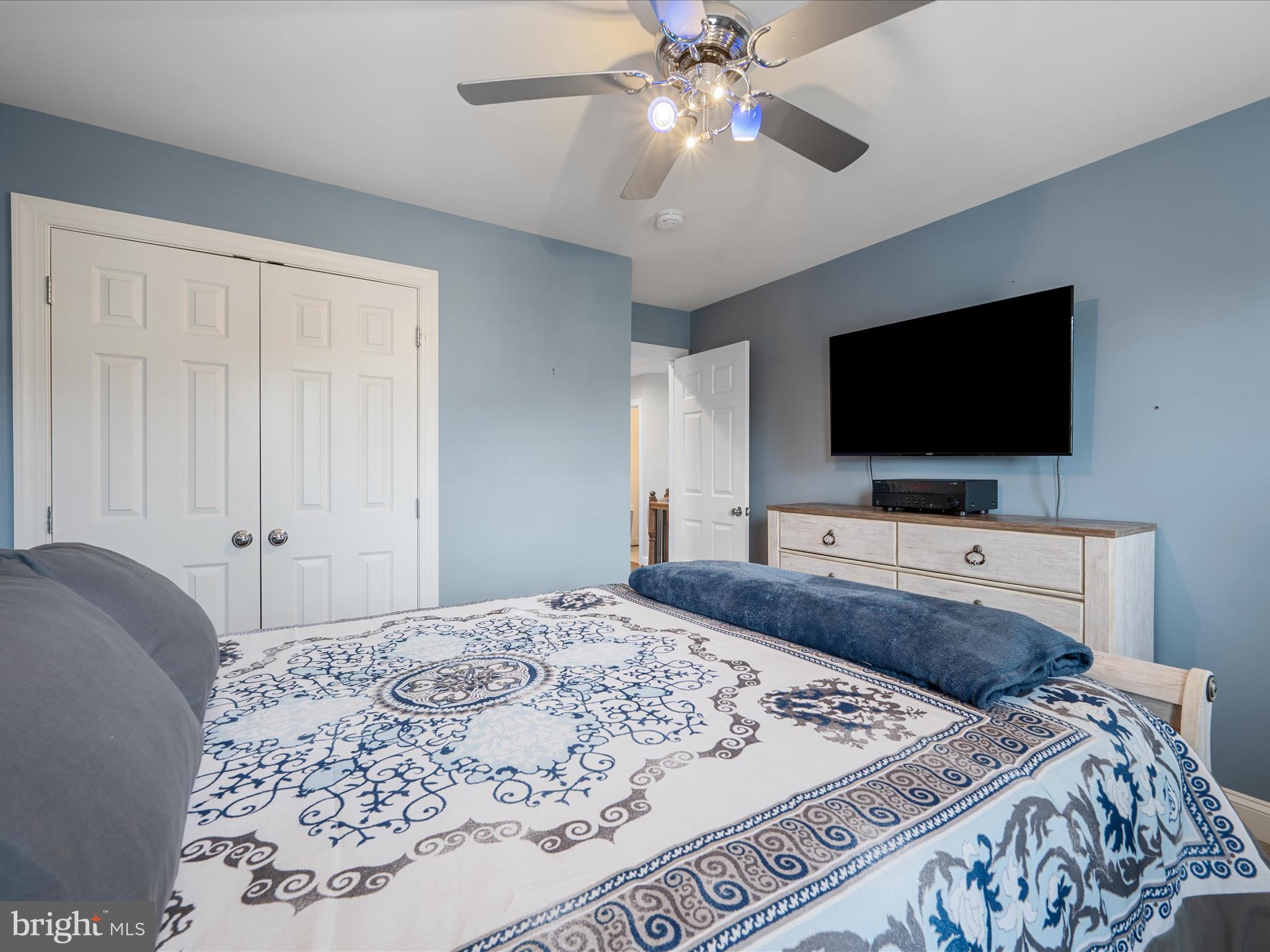 103 Prairie Place Stephenson, VA 22656 - Photo 42 of 90 a bedroom with a bed and a flat screen tv