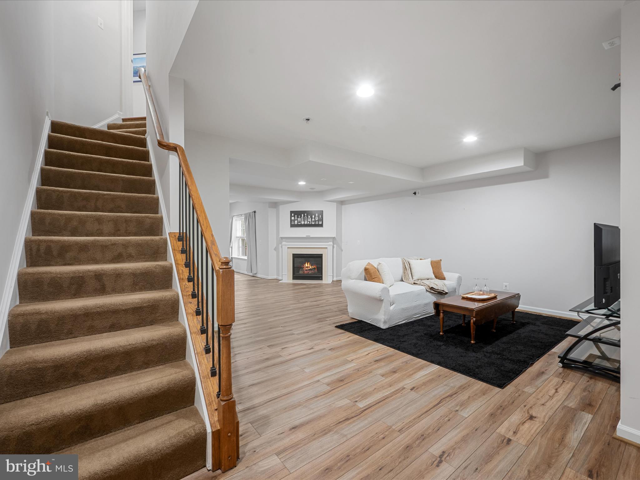 103 Prairie Place Stephenson, VA 22656 - Photo 45 of 90 a living room with furniture and a wooden floor