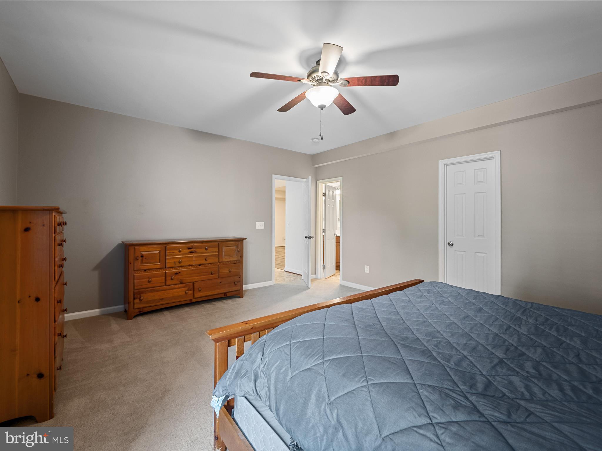 103 Prairie Place Stephenson, VA 22656 - Photo 52 of 90 a bedroom with a bed and a chandelier