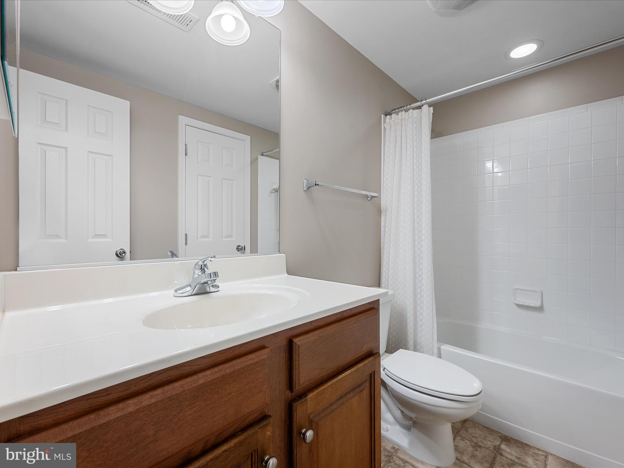 103 Prairie Place Stephenson, VA 22656 - Photo 53 of 90 a bathroom with a sink a toilet a mirror and shower