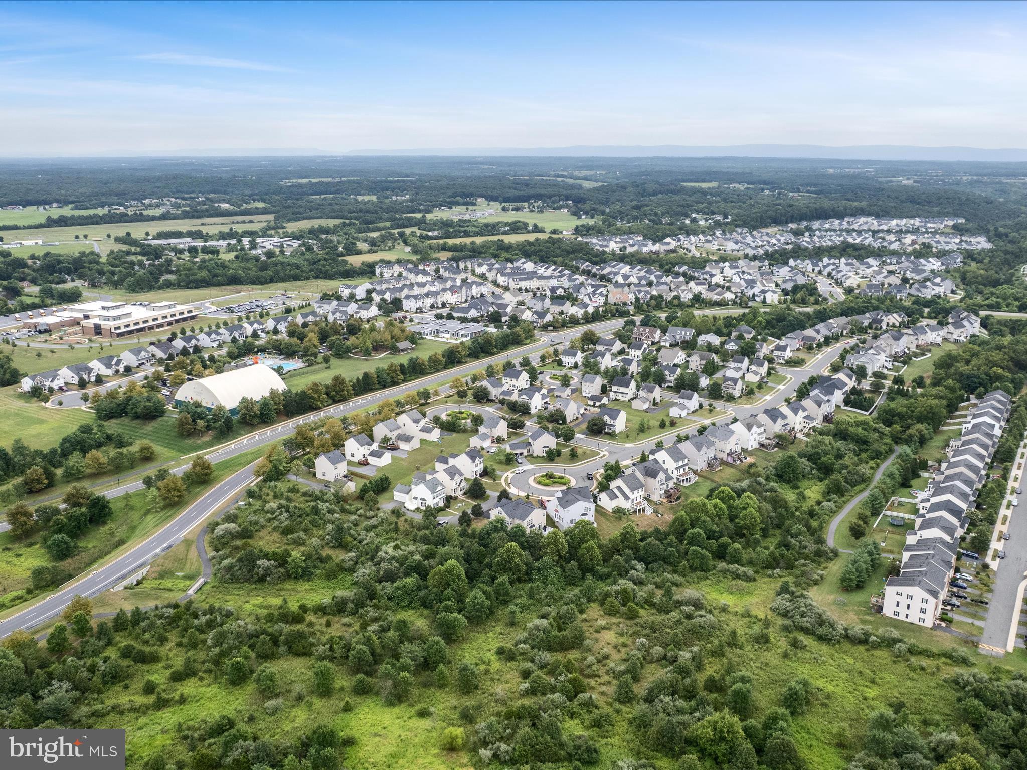 103 Prairie Place Stephenson, VA 22656 - Photo 71 of 90 an aerial view of residential building and green space