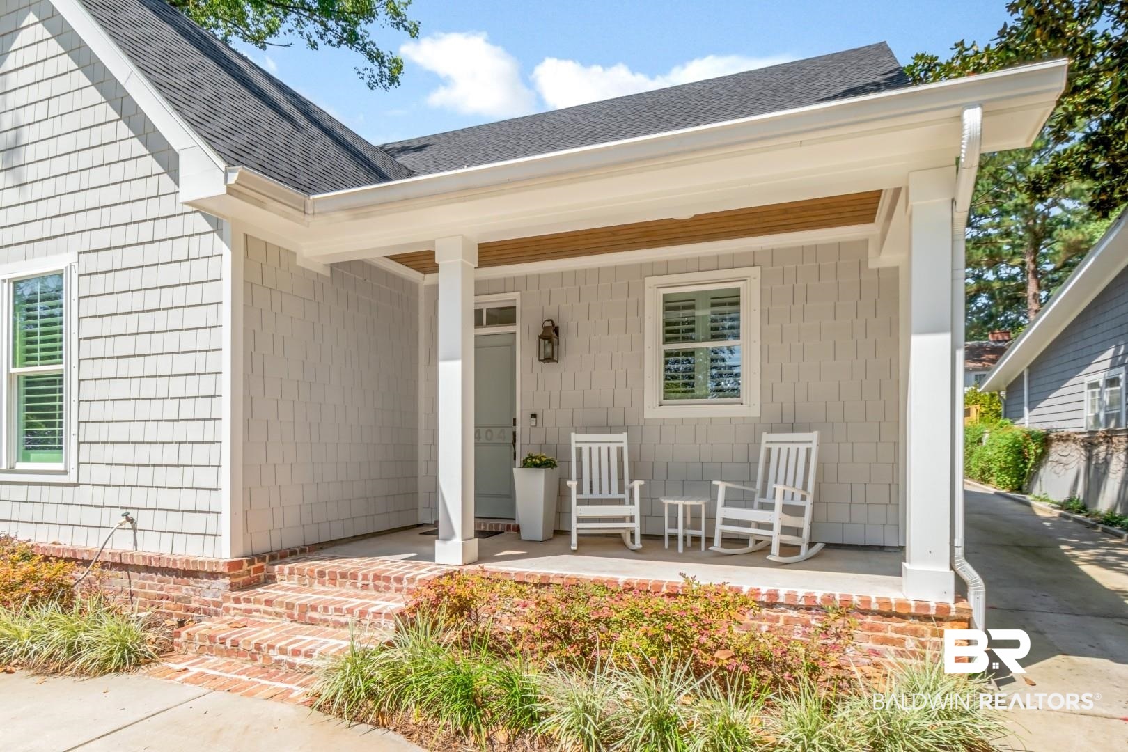 4404 Stein Street Mobile, AL 36608 - Photo 2 of 50 View of exterior entry with a porch and roof with shingles