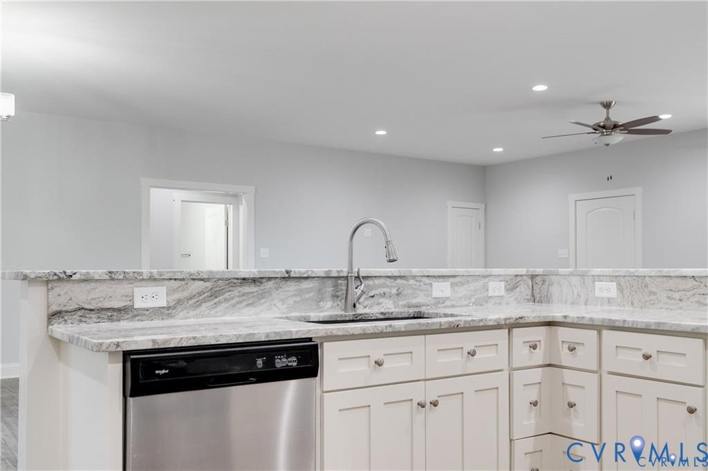 3840 Maidens Road Powhatan, VA 23139 - Photo 9 of 23 Kitchen featuring dishwasher, white cabinets, ligh
