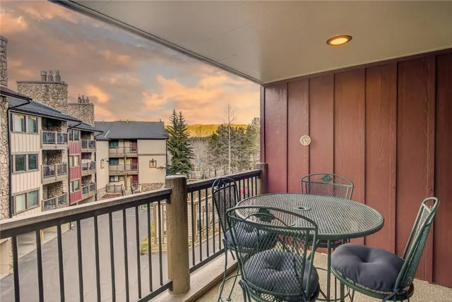 a view of a balcony with furniture
