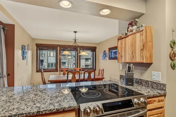 a kitchen with stainless steel appliances granite countertop a stove and a sink