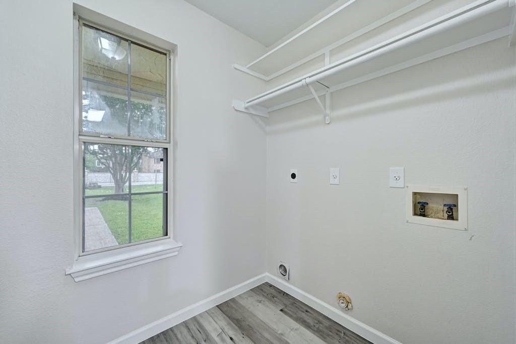 2320 Riddle Road, Unit A Austin, TX 78748 - Photo 14 of 25 a view of a small space with wooden floor and a window