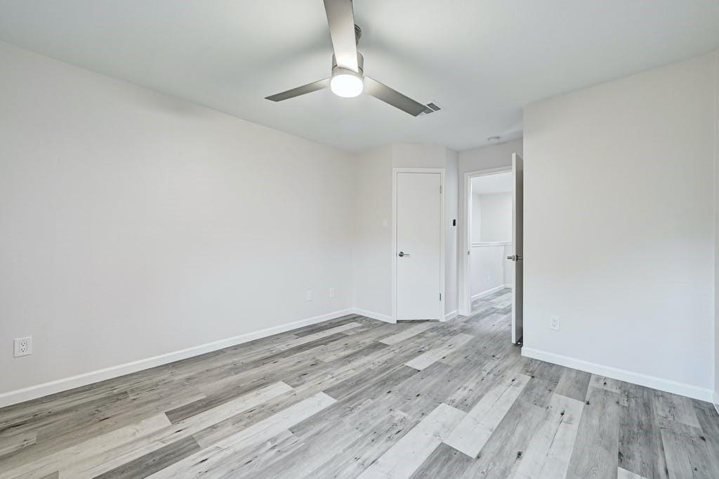2320 Riddle Road, Unit A Austin, TX 78748 - Photo 17 of 25 a view of room with wooden floor and ceiling fan