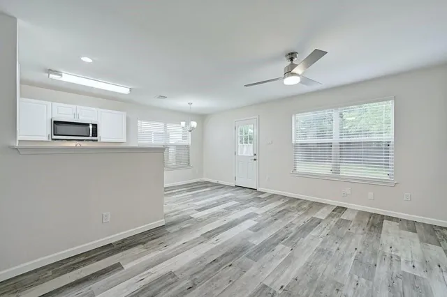 a view of an empty room with a window