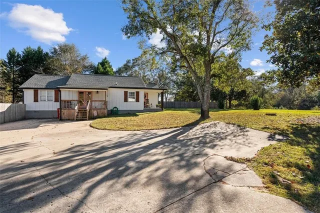 a view of a chairs and table in the balcony
