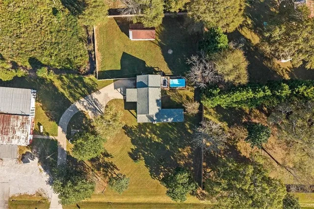 an aerial view of a house having swimming pool