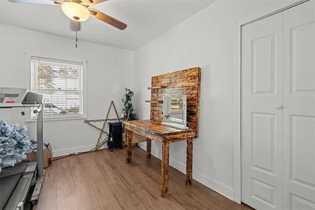 a view of a house with backyard and tree