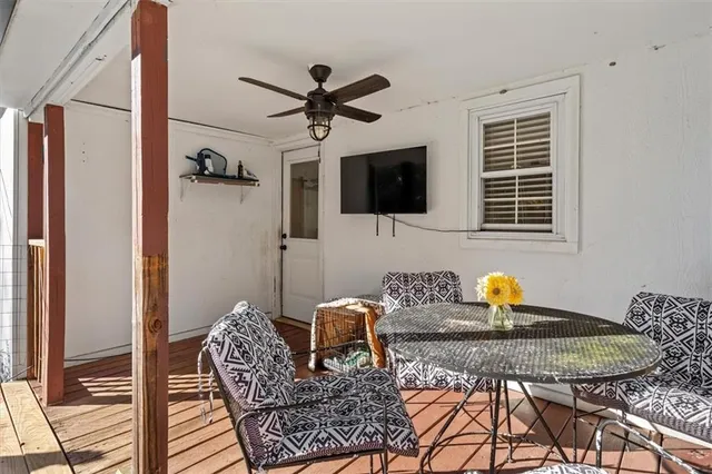 a house view with swimming pool in front of it