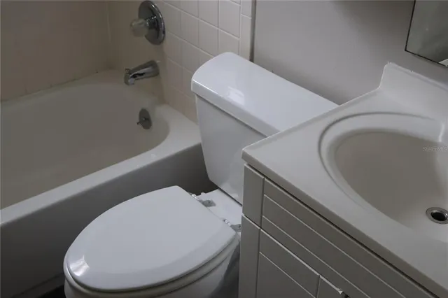 a bathroom with a sink and toilet