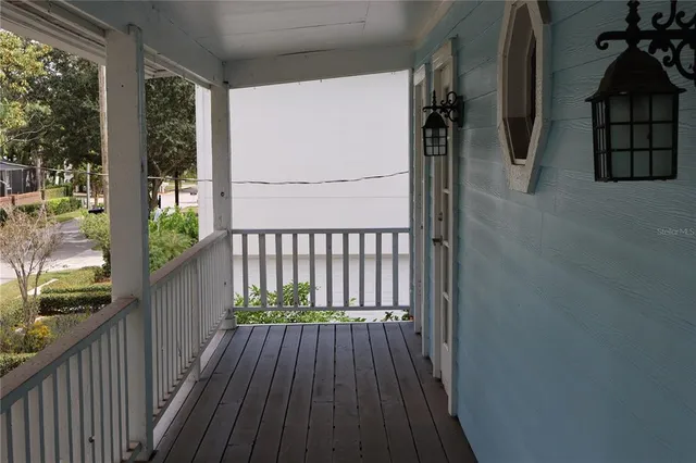 a view of balcony with wooden floor