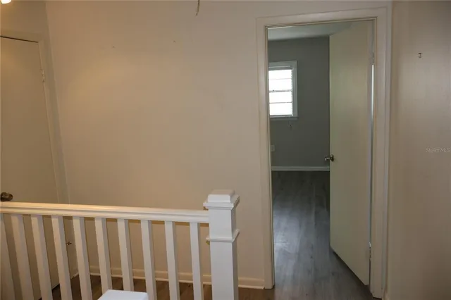 a view of entryway with wooden floor