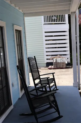 a living room with patio furniture