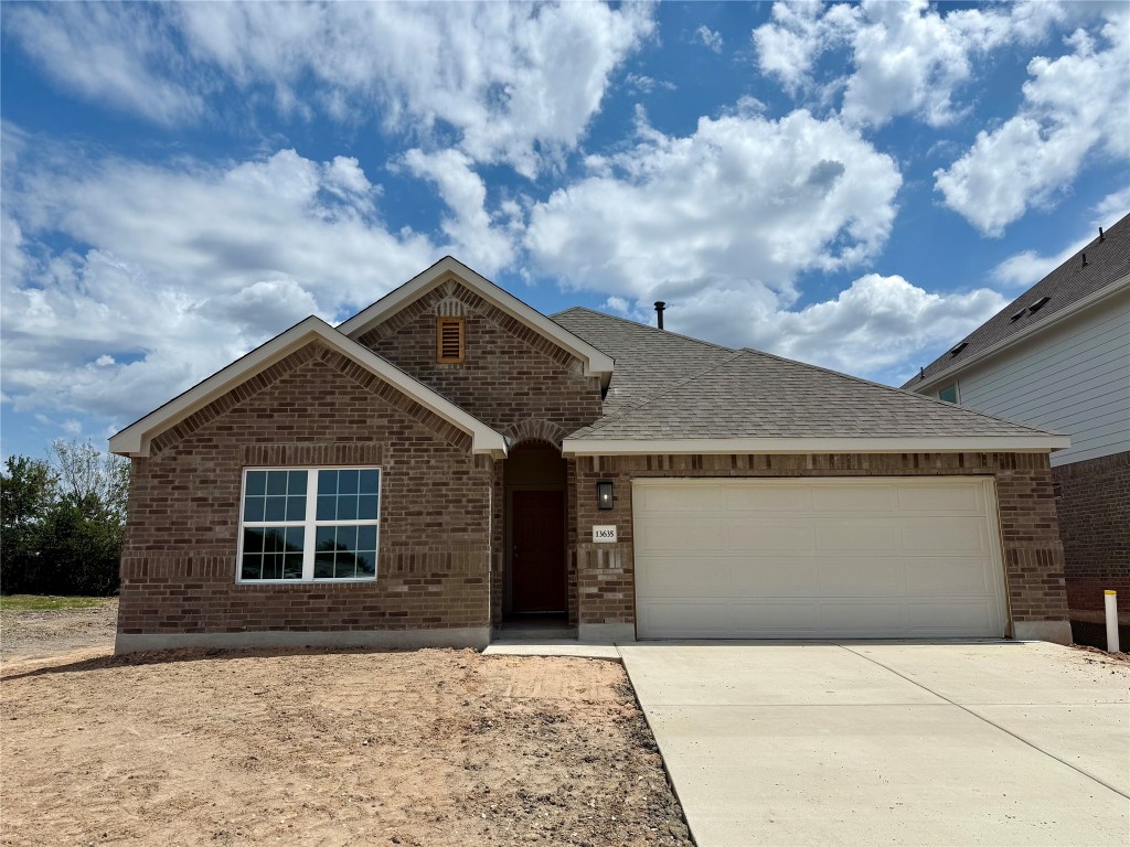 13635 Barn Chime Street Elgin, TX 78621 - Photo 1 of 1 a front view of a house