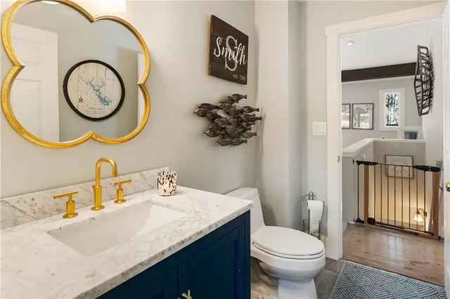 a bathroom with a sink vanity and mirror