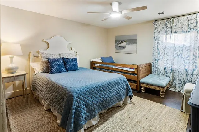 a bedroom with furniture and a chandelier