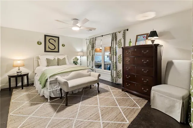 a bedroom with a large bed and a window