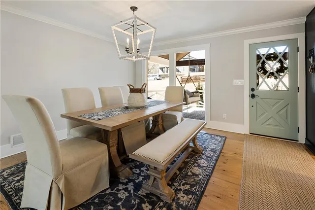 a living room with dining table