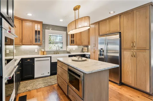 a kitchen with a sink stove and refrigerator
