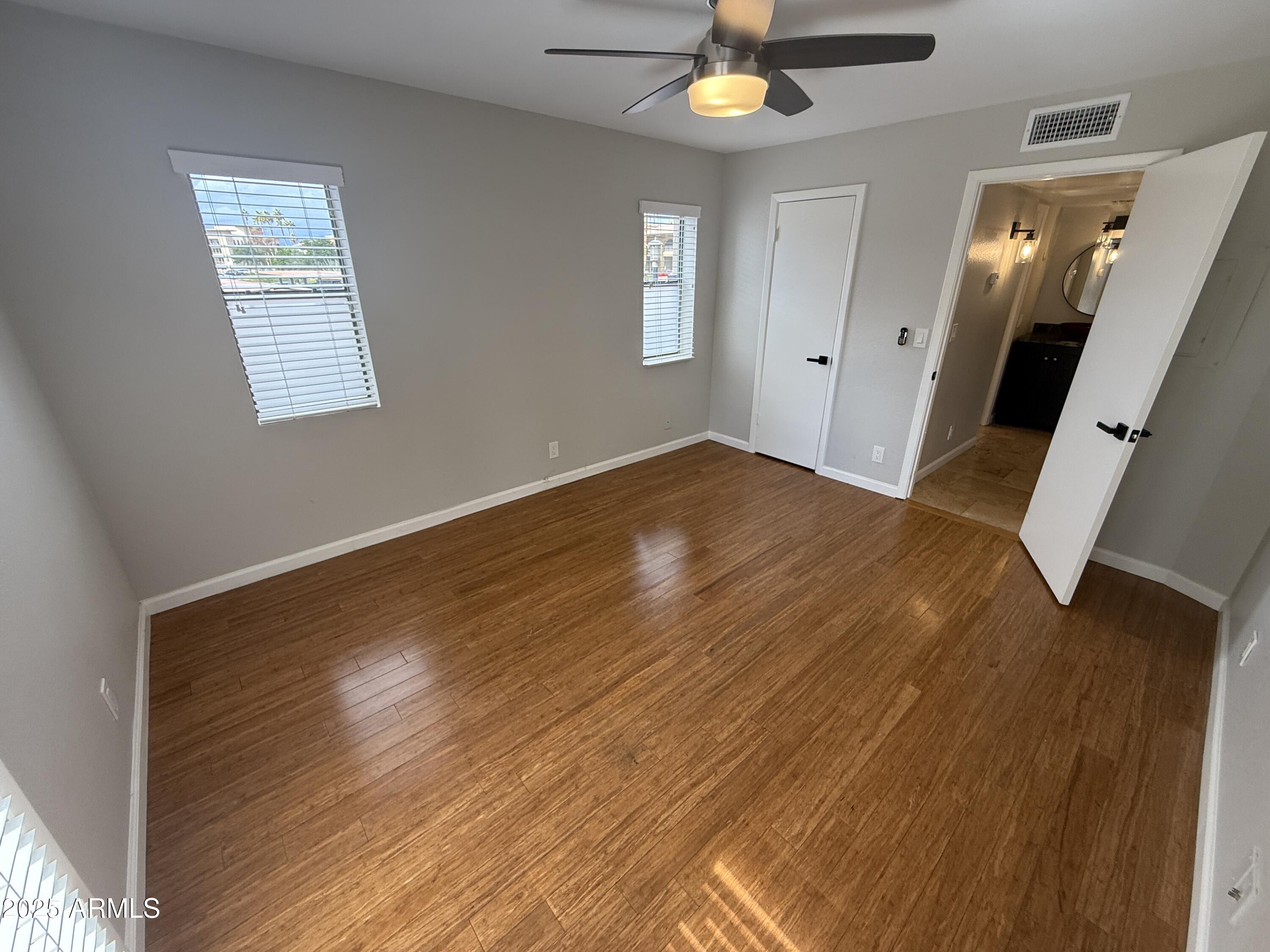 1820 East Morten Avenue, Unit 125 Phoenix, AZ 85020 - Photo 17 of 21 a view of empty room with wooden floor