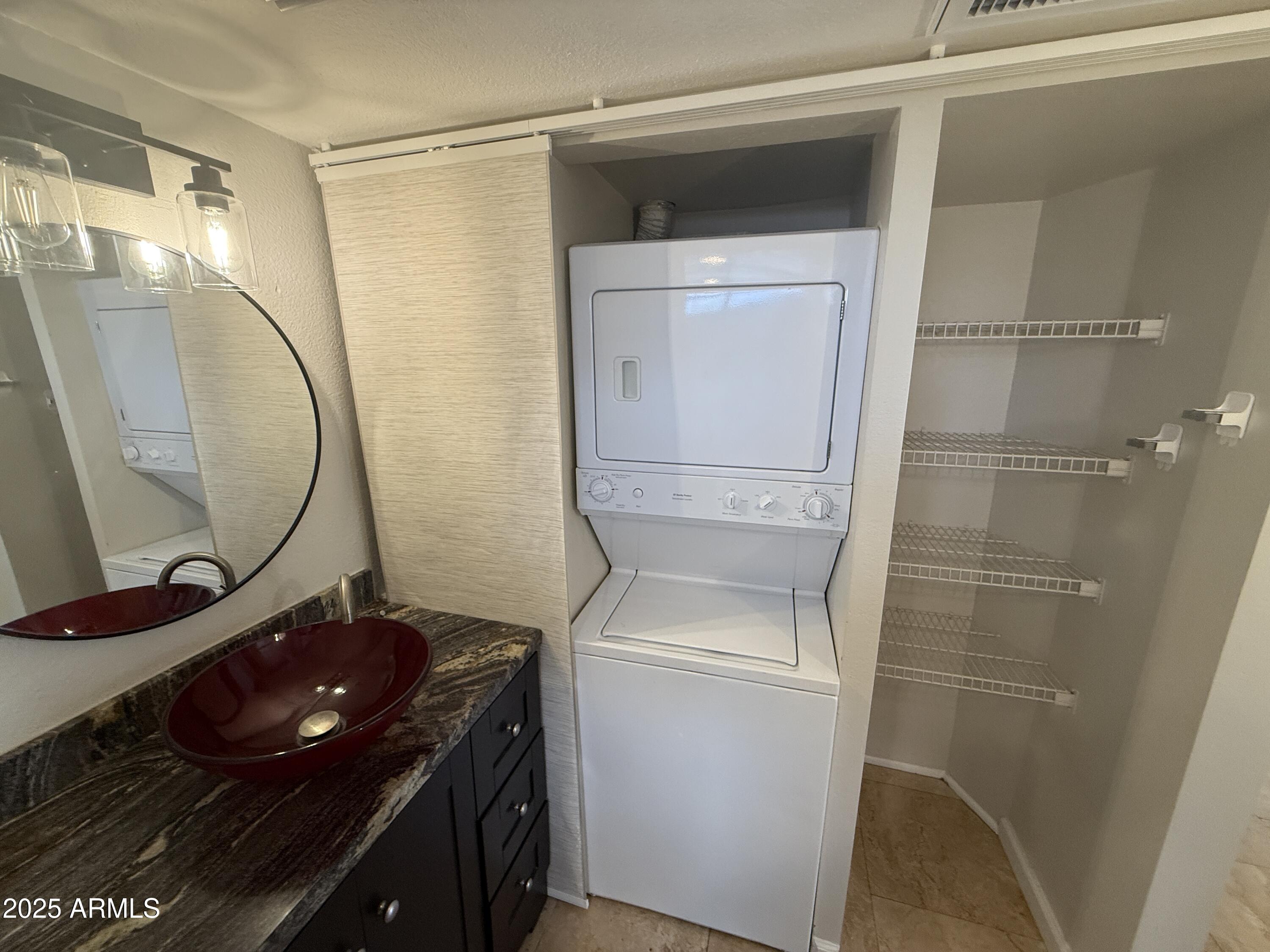 1820 East Morten Avenue, Unit 125 Phoenix, AZ 85020 - Photo 19 of 21 a bathroom with a sink a toilet and a mirror